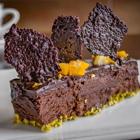 Chocolate Mousse with Cocoa Nib Tuile and Candied Orange on Pistachio Coconut Crust