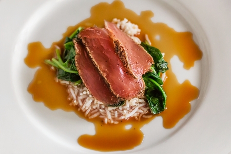 SIGNATURE YELLOWFIN TUNA, Black Pepper Crusted, Braised Spinach, Steamed Basmati Rice, Soy Ginger Sauce