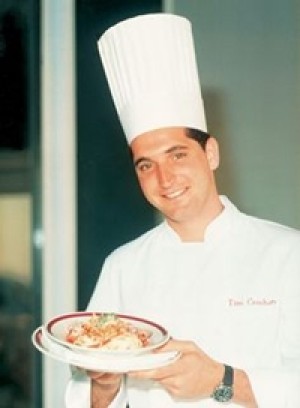 Tim Creehan in his youth, posing with a culinary creation